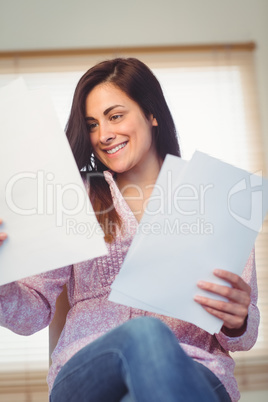 Pretty brunette reading documents