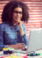 Portrait of a casual businesswoman at her desk