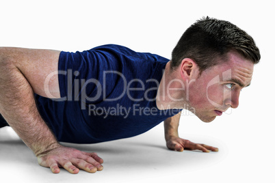 A fit man doing push ups