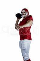 American football player throwing ball