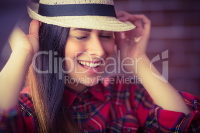 Beautiful hipster laughing at camera