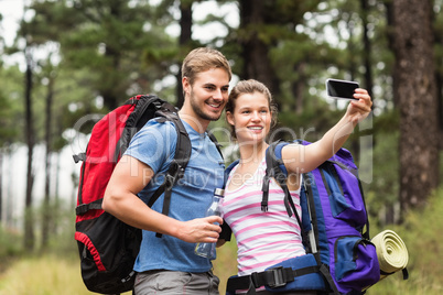 Young happy couple hiking in the nature