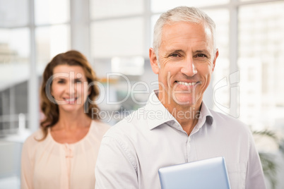 Casual business colleagues smiling at camera