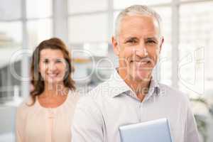 Casual business colleagues smiling at camera