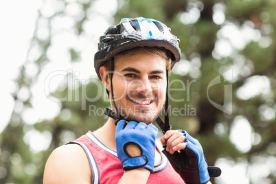 Handsome young biker looking at camera