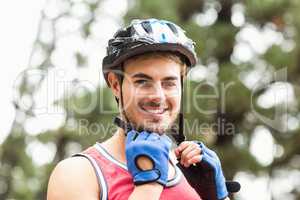 Handsome young biker looking at camera