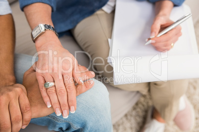 Close up view of therapist comforting male patient