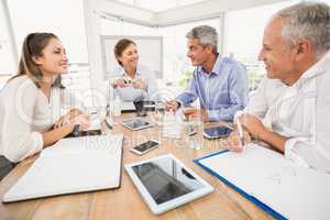 Smiling business people having a meeting