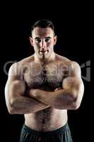 Handsome bodybuilder with arms crossed