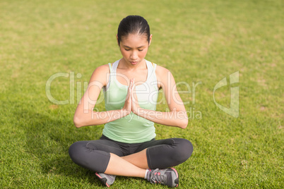 Peaceful sporty woman doing yoga