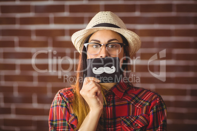 Beautiful hipster with mustache on wallet