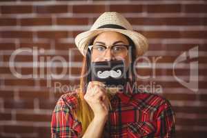 Beautiful hipster with mustache on wallet