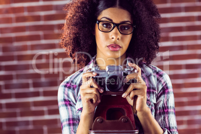 Attractive focused hipster photographing