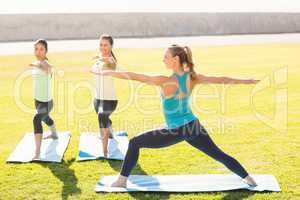 Sporty women attending yoga class