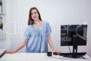 Shop worker standing by the till