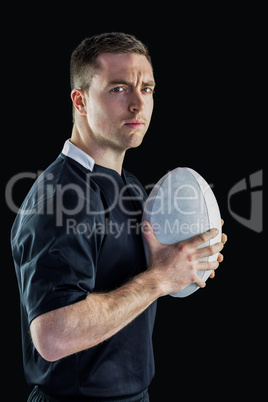 Rugby player holding a rugby ball