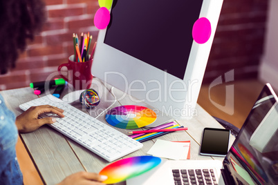 Female graphic designer working at desk
