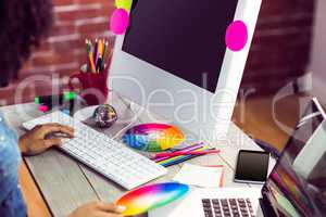 Female graphic designer working at desk