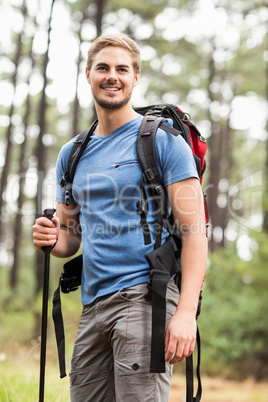 Young handsome hiker looking away