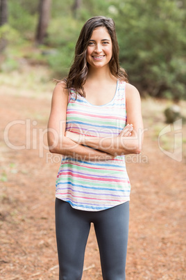 Young happy jogger looking at camera