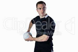 Rugby player about to throw a rugby ball