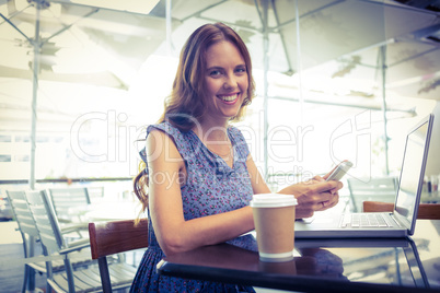 Pretty brunette using her laptop