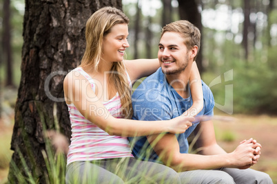 Young happy hiker couple looking at each other