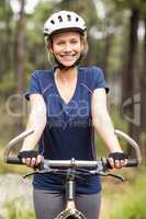 Young pretty happy biker looking at camera