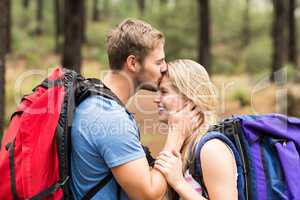 Young happy hiker couple kissing