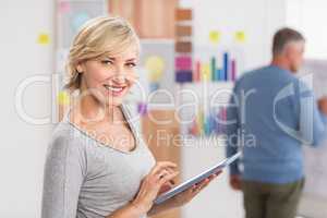 Smiling businesswoman using a digital tablet