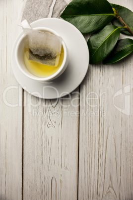 Cup of herbal tea on table