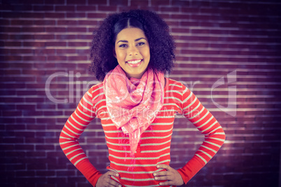 Smiling attractive woman with hands on hips