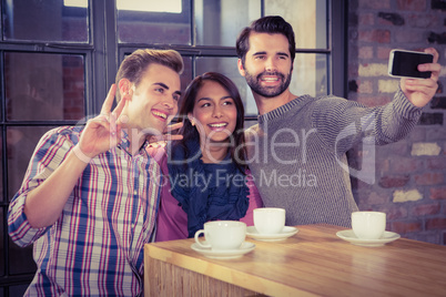 Group of friends looking at their smartphone