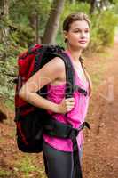 Smiling blonde hiker with backpack