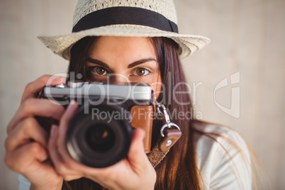 Pretty hipster using her vintage camera