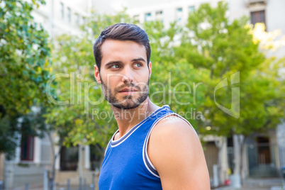 Handsome athlete looking away