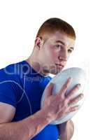 Rugby player holding rugby ball