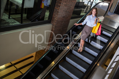 Pretty woman on the escalator