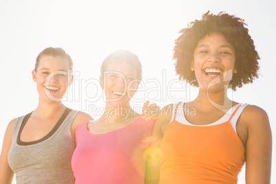 Sporty women laughing at camera