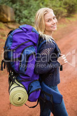 Smiling female hiker looking at the camera