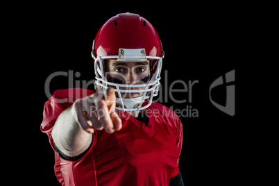 Portrait of american football player pointing to camera