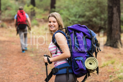 Portrait of a young happy hiker woman