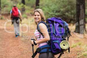 Portrait of a young happy hiker woman