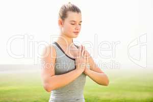 Peaceful sporty blonde meditating