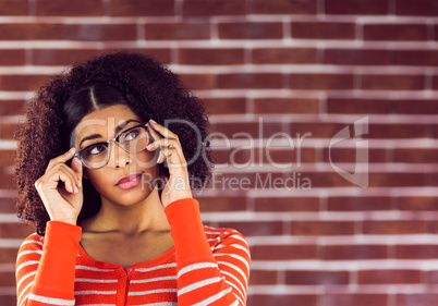 Attractive young woman posing with hipster glasses