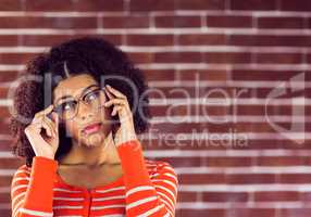 Attractive young woman posing with hipster glasses