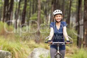 Young pretty happy biker looking at camera