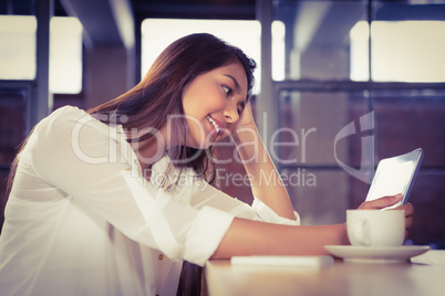 A beautiful businesswoman using a tablet