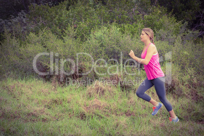 Pretty blonde athlete jogging