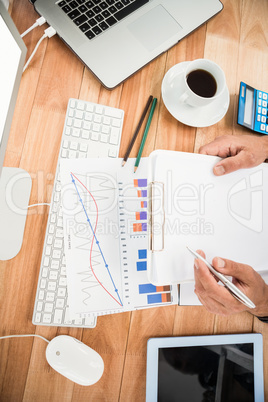 Businessman working on wooden desk